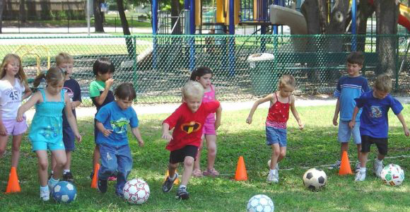 Children playing with soccer balls